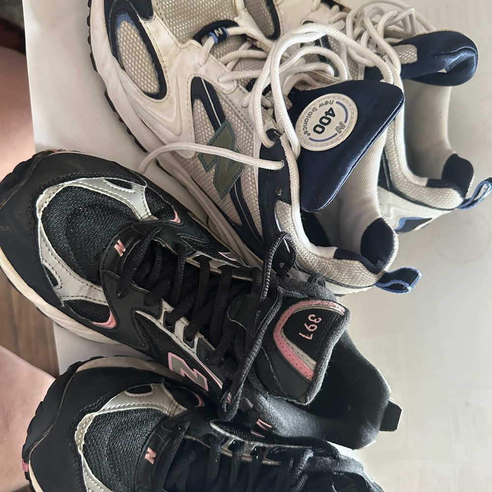 Two pairs of women's size 10 new balance sneakers. White and navy/black & pink